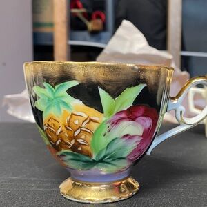 Elegant Gold and Multicolor Porcelain Teacup